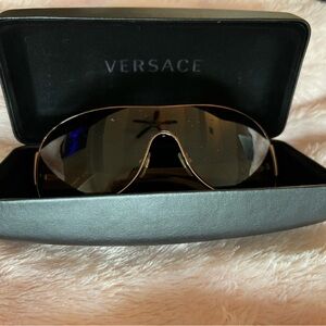 Versace sunglasses and case.